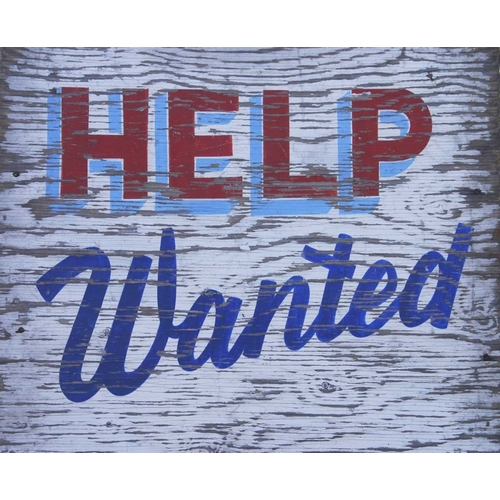Weathered help-wanted sign